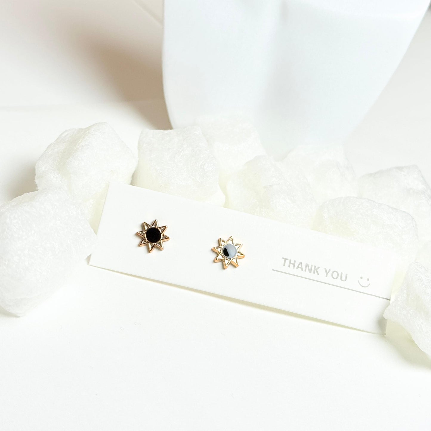Star-Shaped Stud Earrings with Gold Trim and Black and White Enamel Centers G